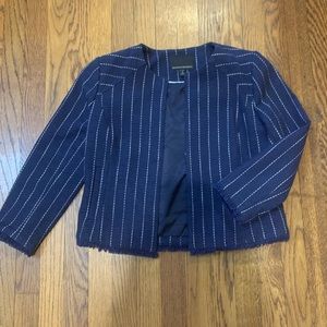 Great navy work blazer with fringe edges and single clasp.